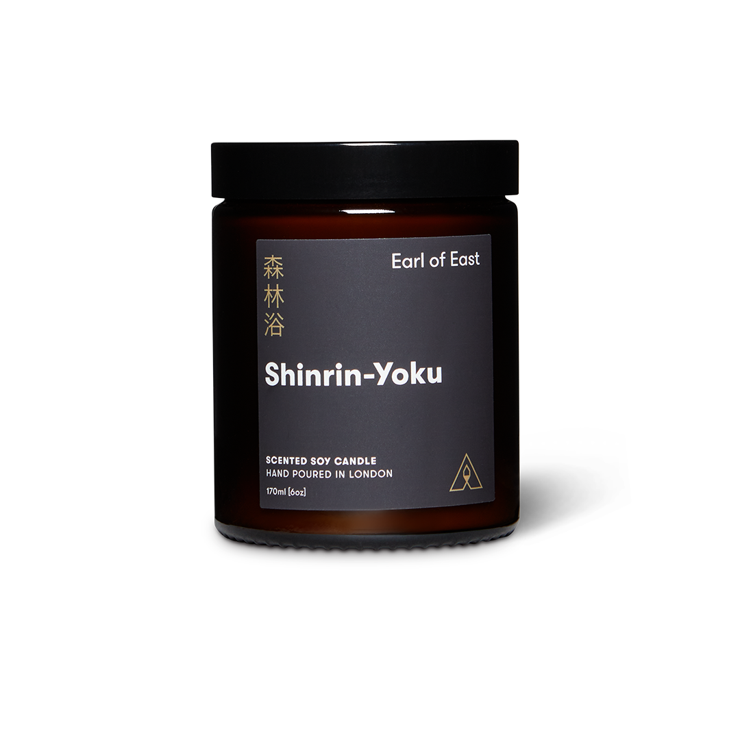 Scented soy candle jar with 'Shinrin-Yoku' label on a white background