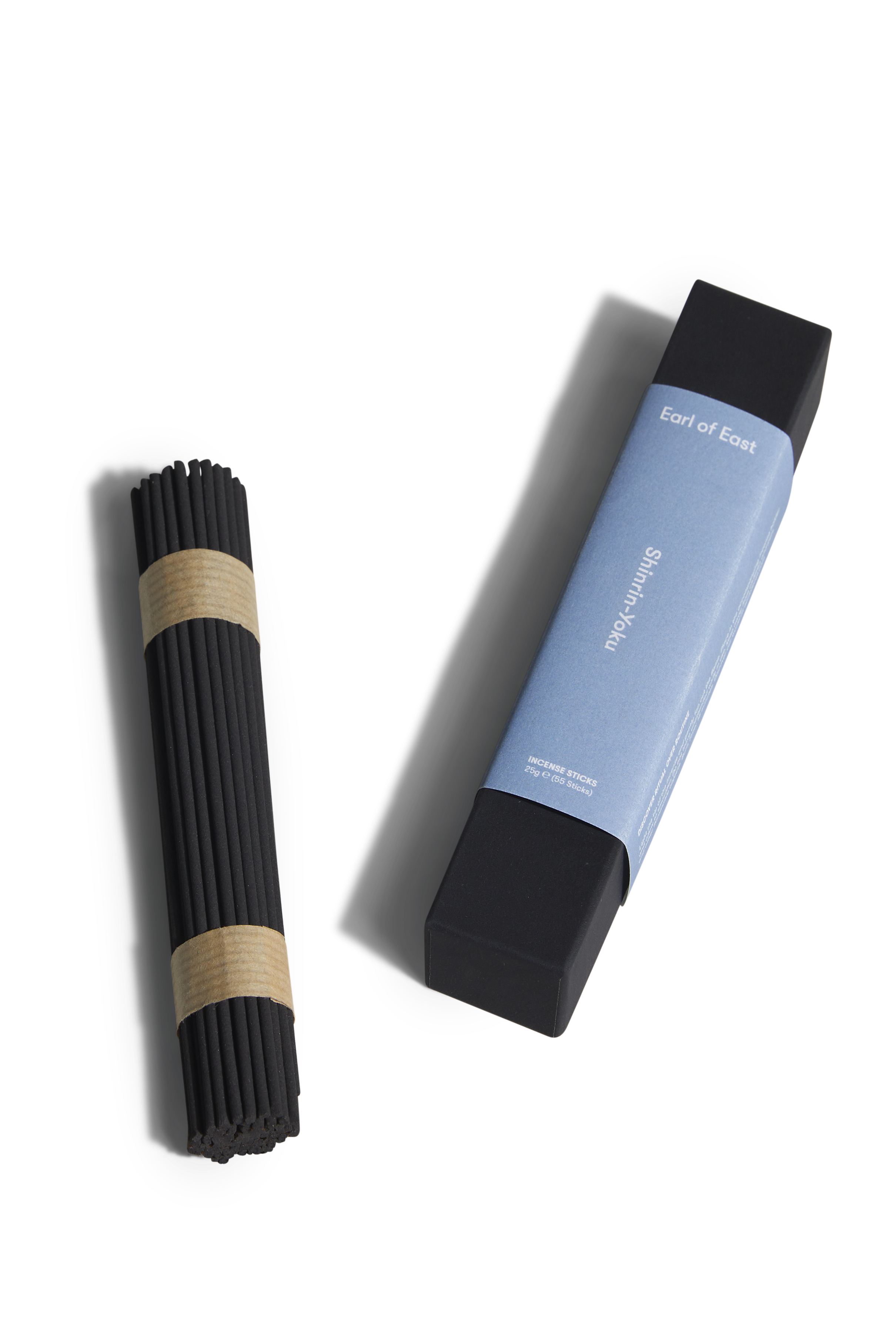 Two incense products on a white background, one black and one blue with branding.