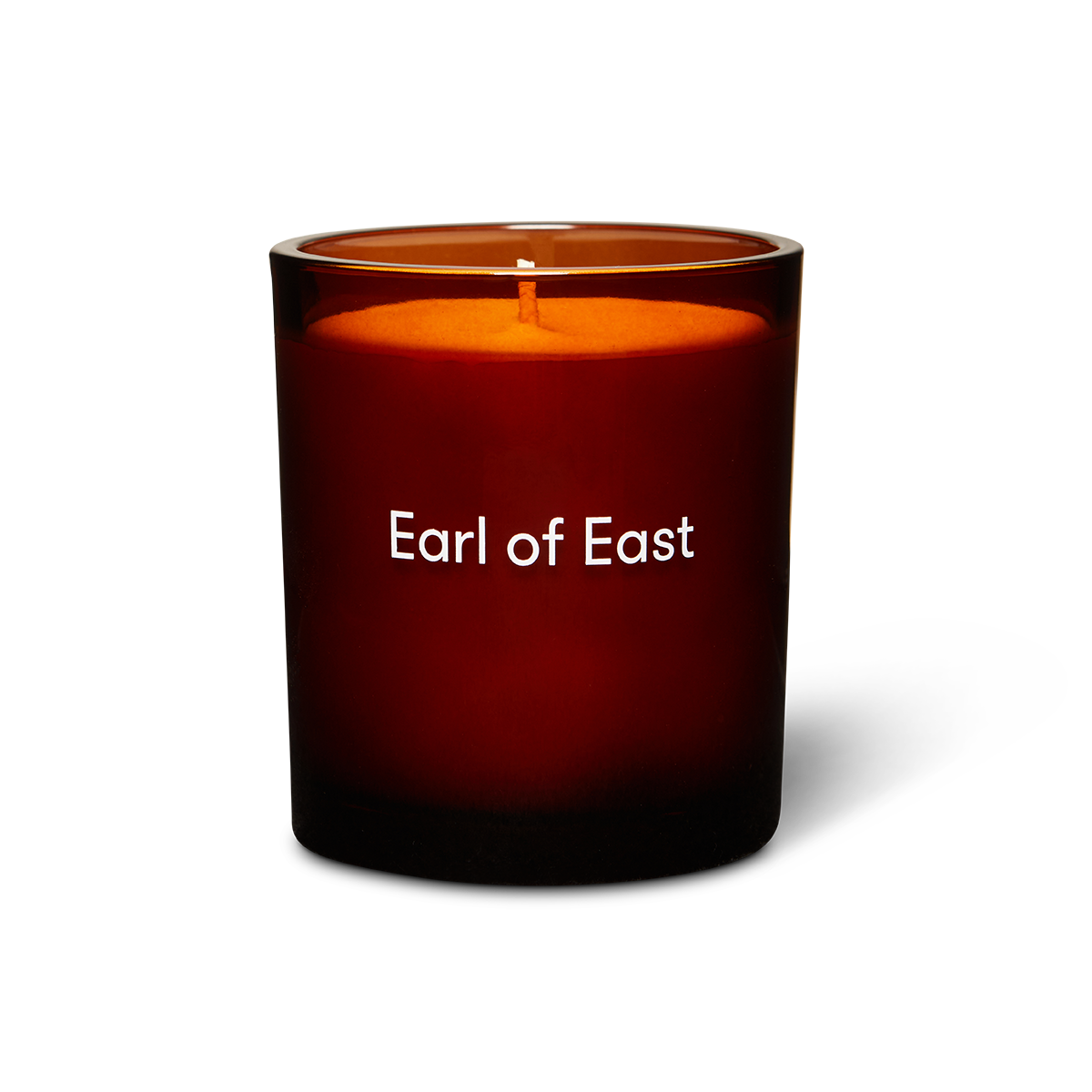 Candle with 'Earl of East' branding on a white background