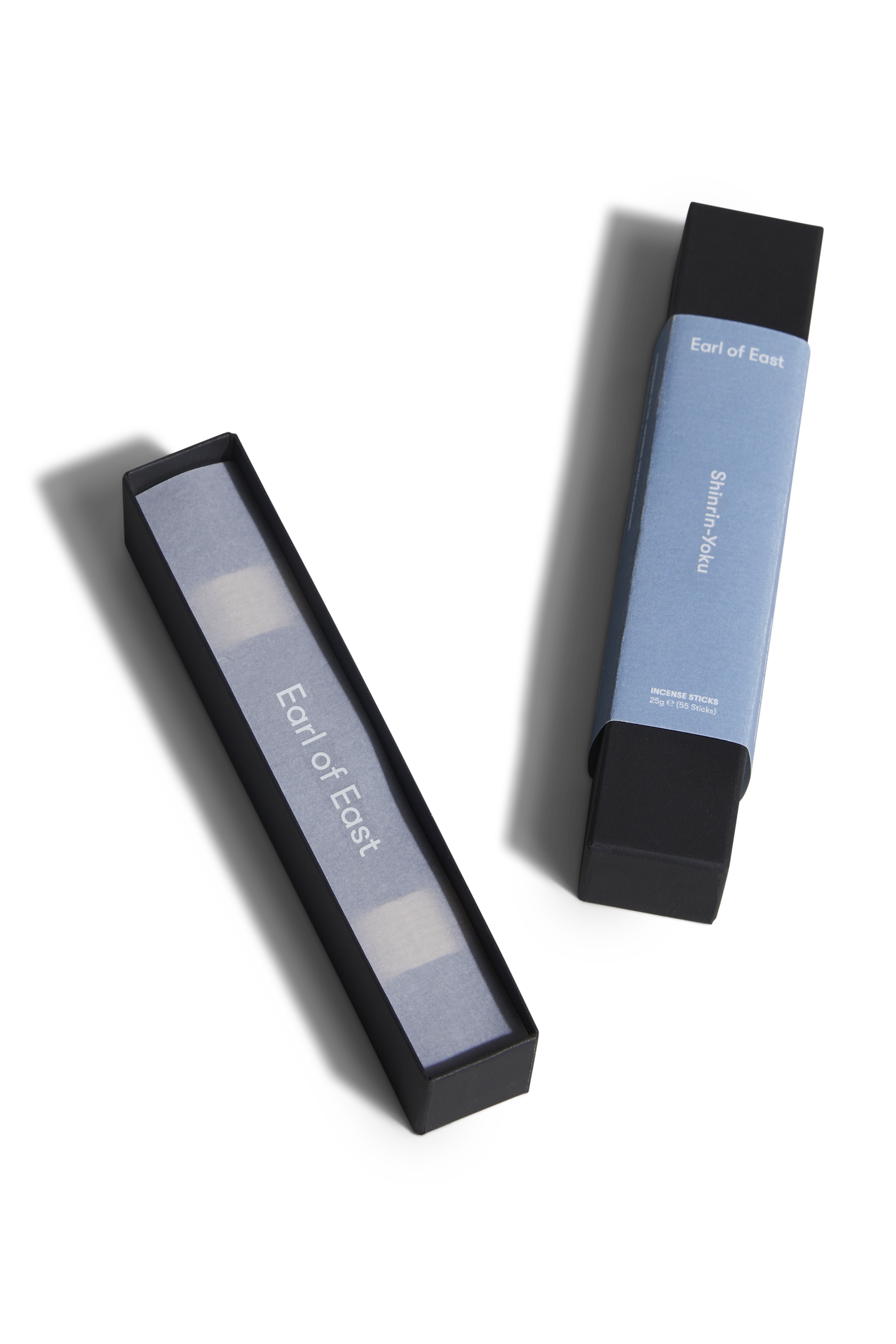 Two black and blue cosmetic products with 'Earl of East' branding on a white background